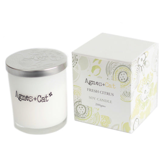 Detailed close up view highlighting the high quality craftsmanship and individual features of the agnes cat votive candle fresh citrus416