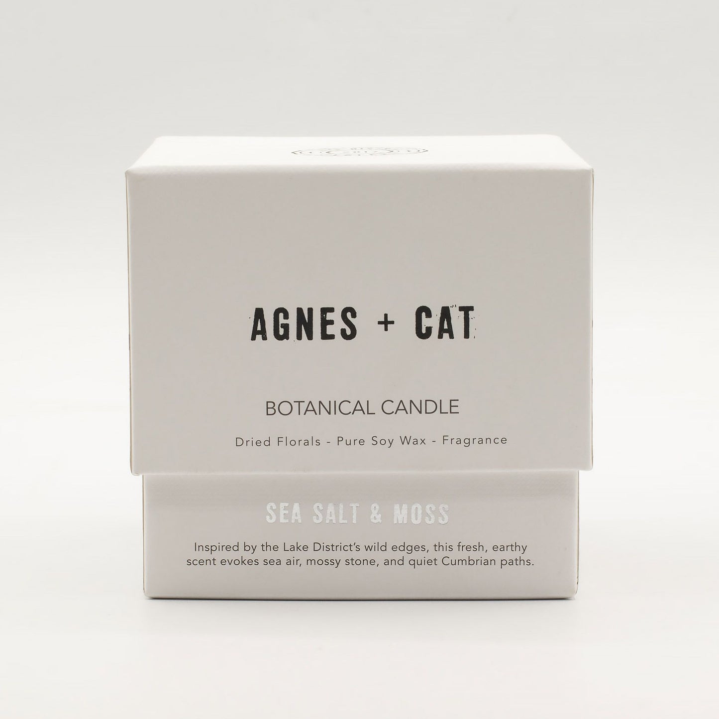 Detailed close up view highlighting the high quality craftsmanship and individual features of the agnes cat botanical soy wax candle seasalt moss559