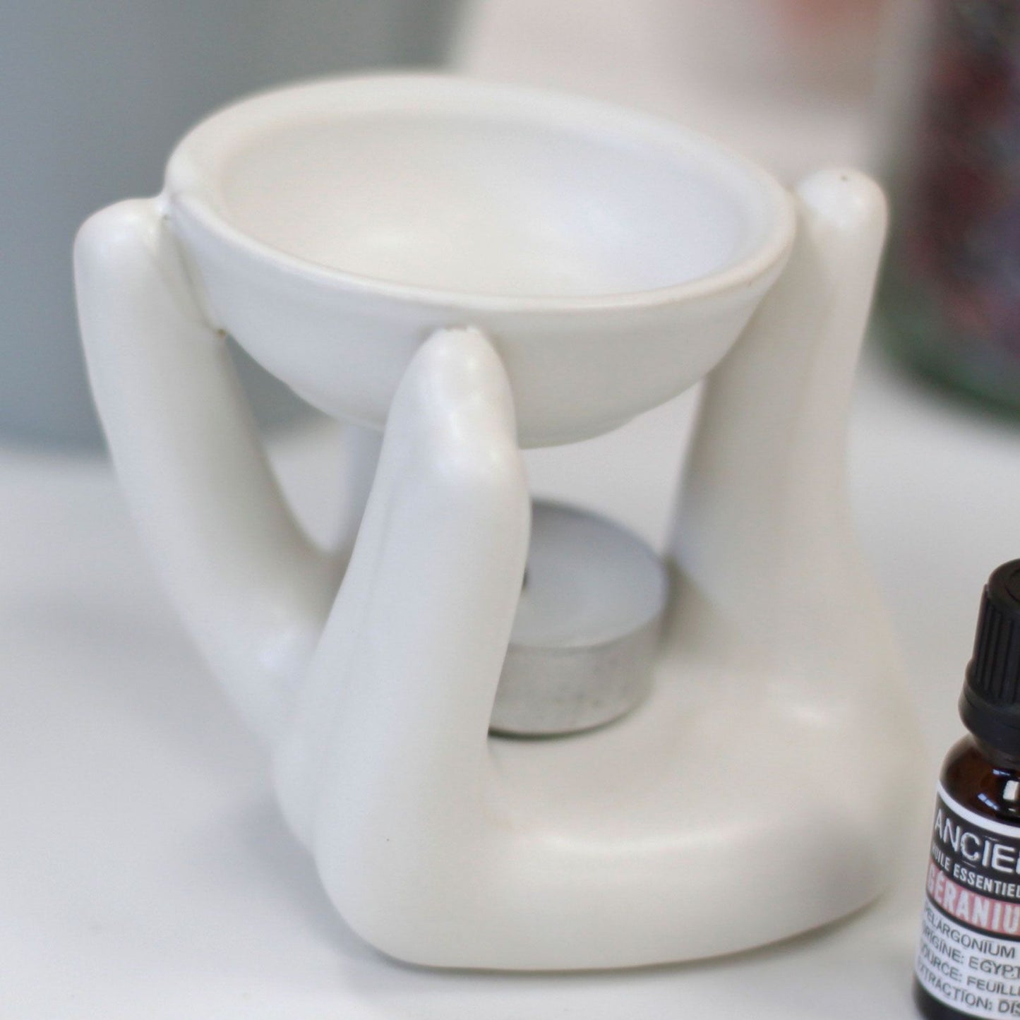 Helping Hand Oil Burner  - White lifestyle product photo on neutral background