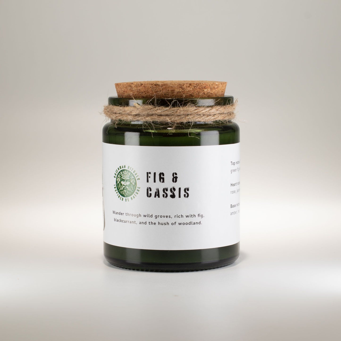 Detailed close up view highlighting the high quality craftsmanship and individual features of the greenman woodwick soy candle fig cassis407