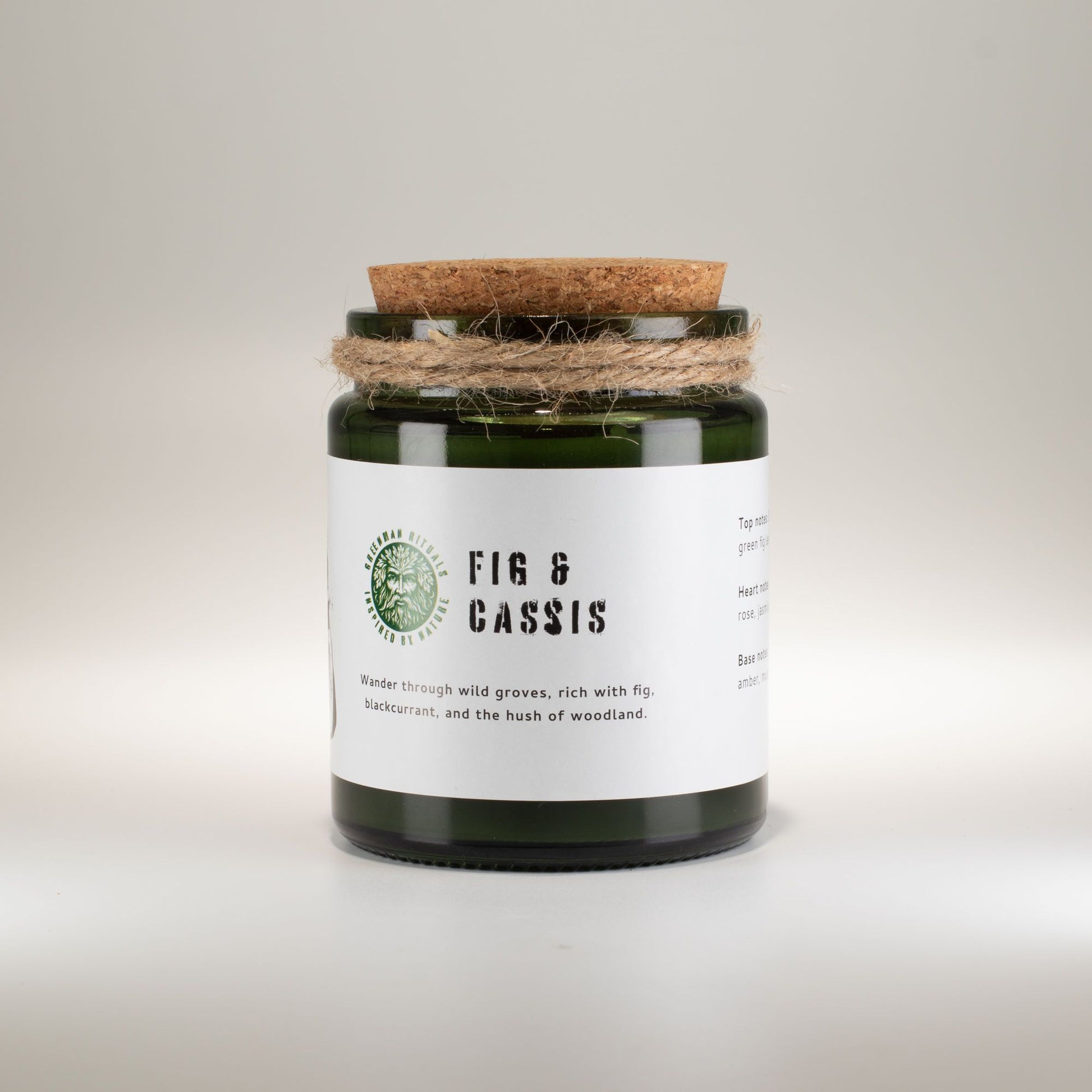 Detailed close up view highlighting the high quality craftsmanship and individual features of the greenman woodwick soy candle fig cassis407