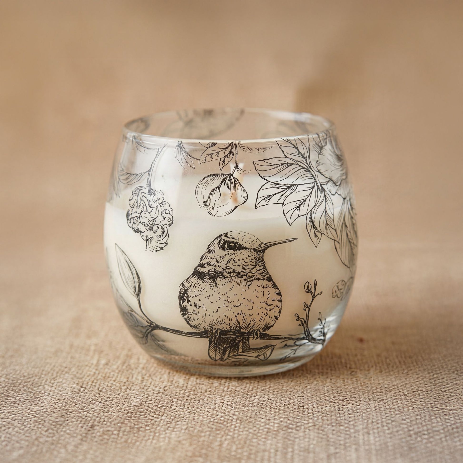 Detailed close up view highlighting the high quality craftsmanship and individual features of the small glass jar candles drawn by flame537