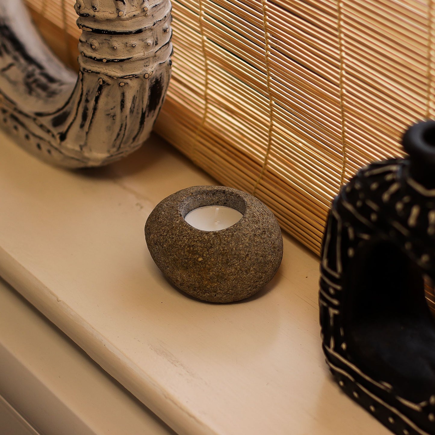 Detailed close up view highlighting the high quality craftsmanship and individual features of the natural riverstone candle holder single nightlight614