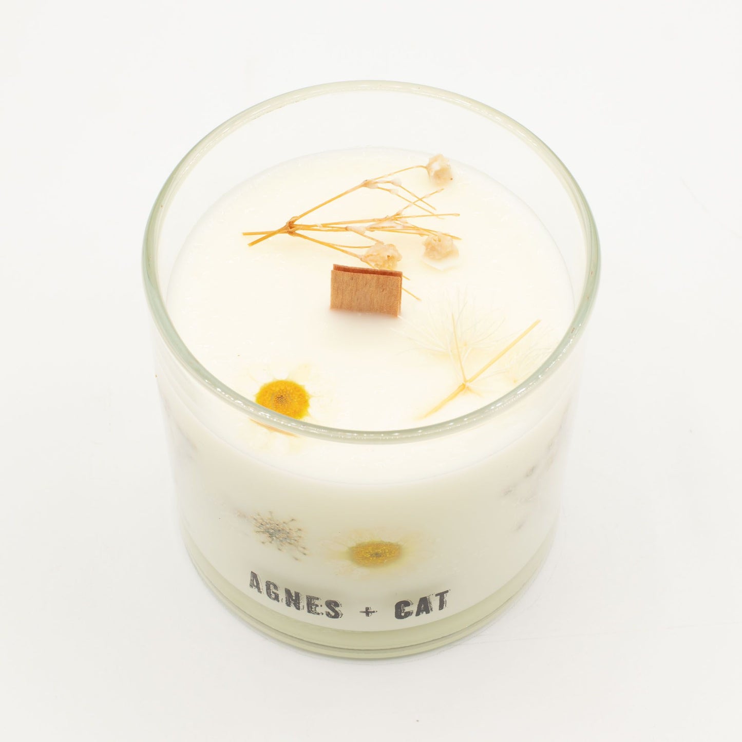 Detailed close up view highlighting the high quality craftsmanship and individual features of the agnes cat botanical soy wax candle windermere525