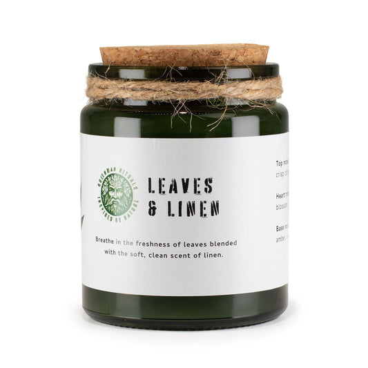 Luxury presentation of the greenman woodwick soy candle leaves linen450 showing the premium artisan packaging and complete set contents