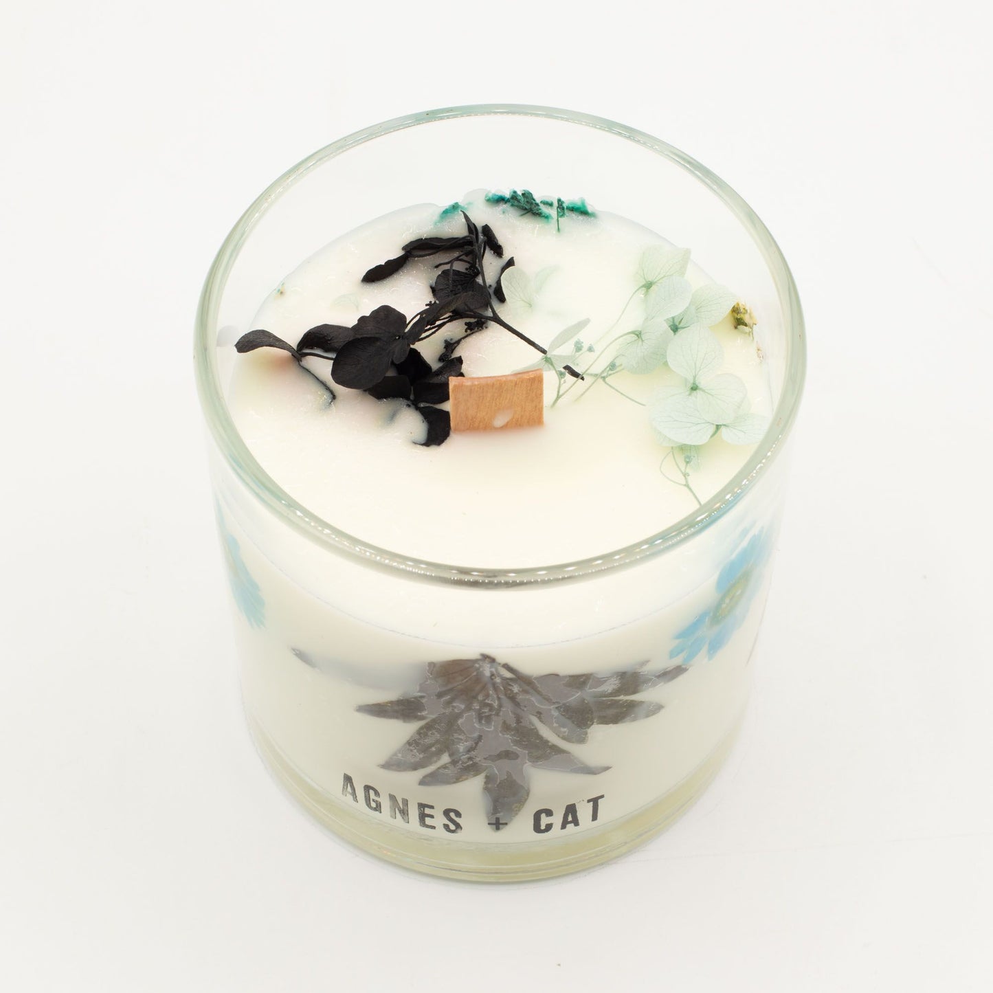Detailed close up view highlighting the high quality craftsmanship and individual features of the agnes cat botanical soy wax candle seasalt moss559