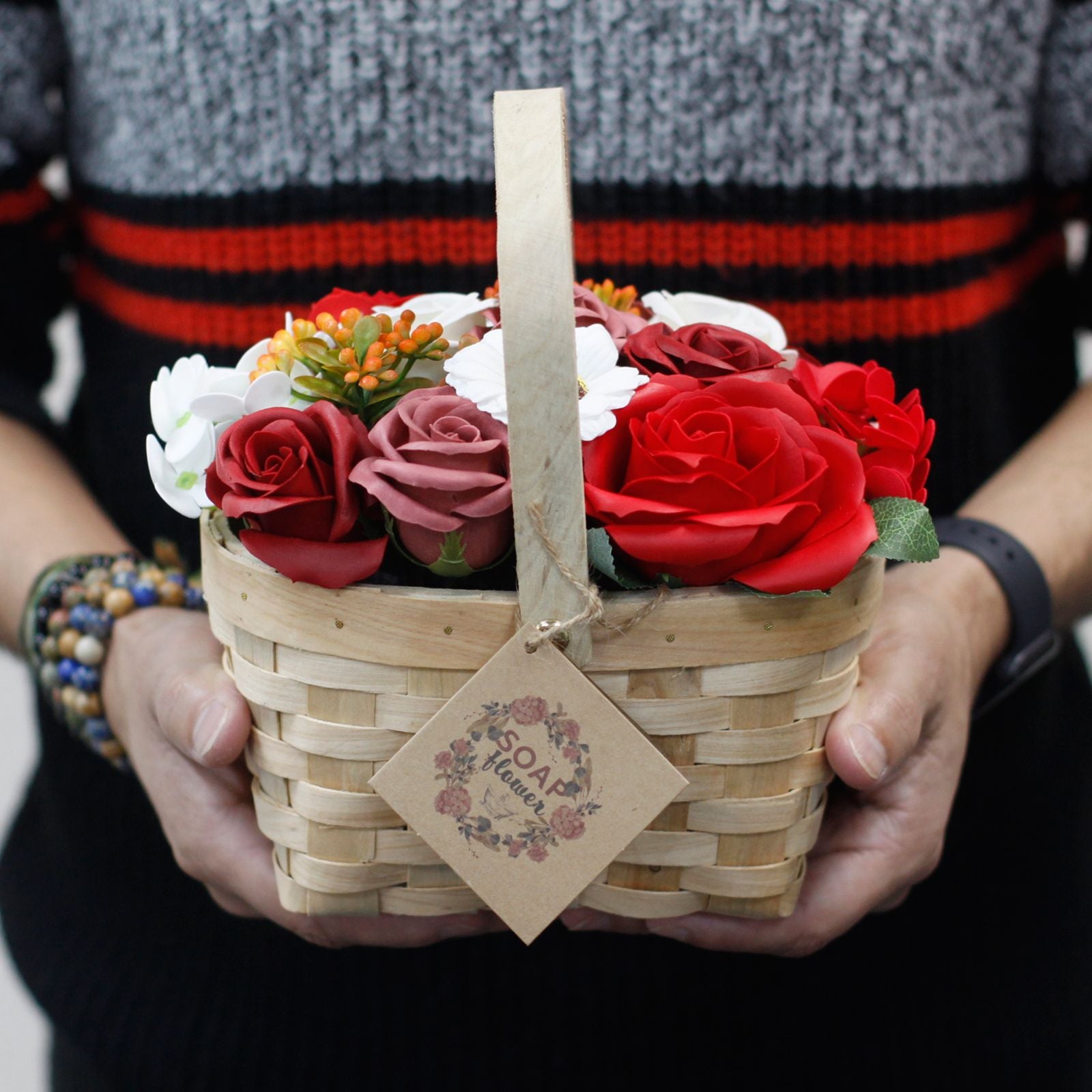 Detailed close up view highlighting the high quality craftsmanship and individual features of the large red bouquet in wicker basket823
