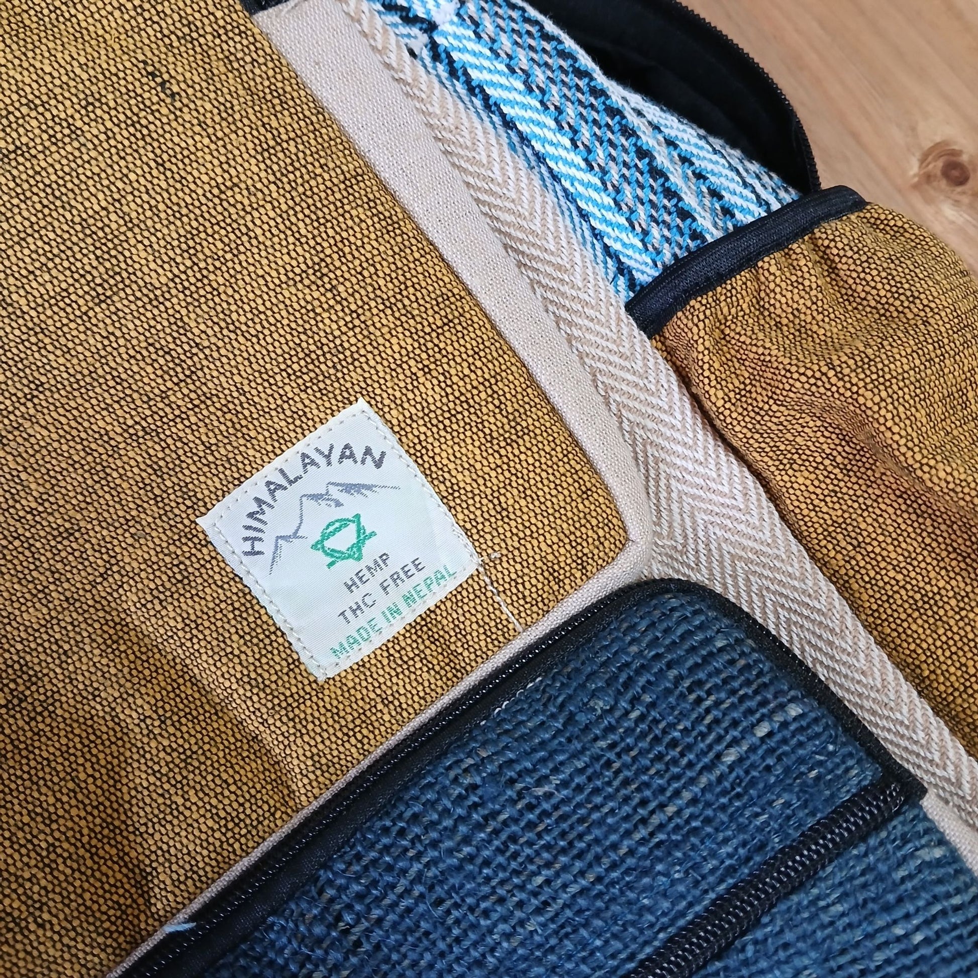 Large Boxy Hemp Backpack - Teal & Tumeric lifestyle product photo on neutral background