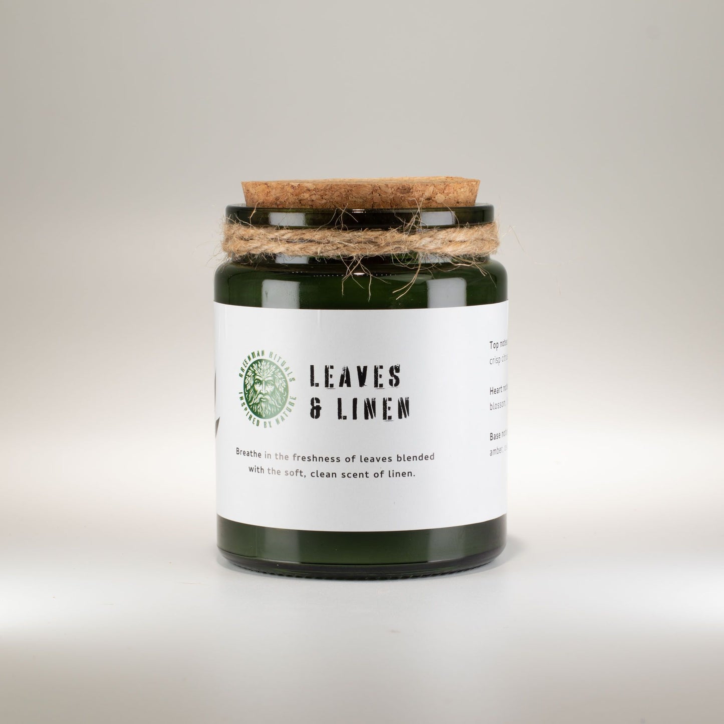 Detailed close up view highlighting the high quality craftsmanship and individual features of the greenman woodwick soy candle leaves linen450