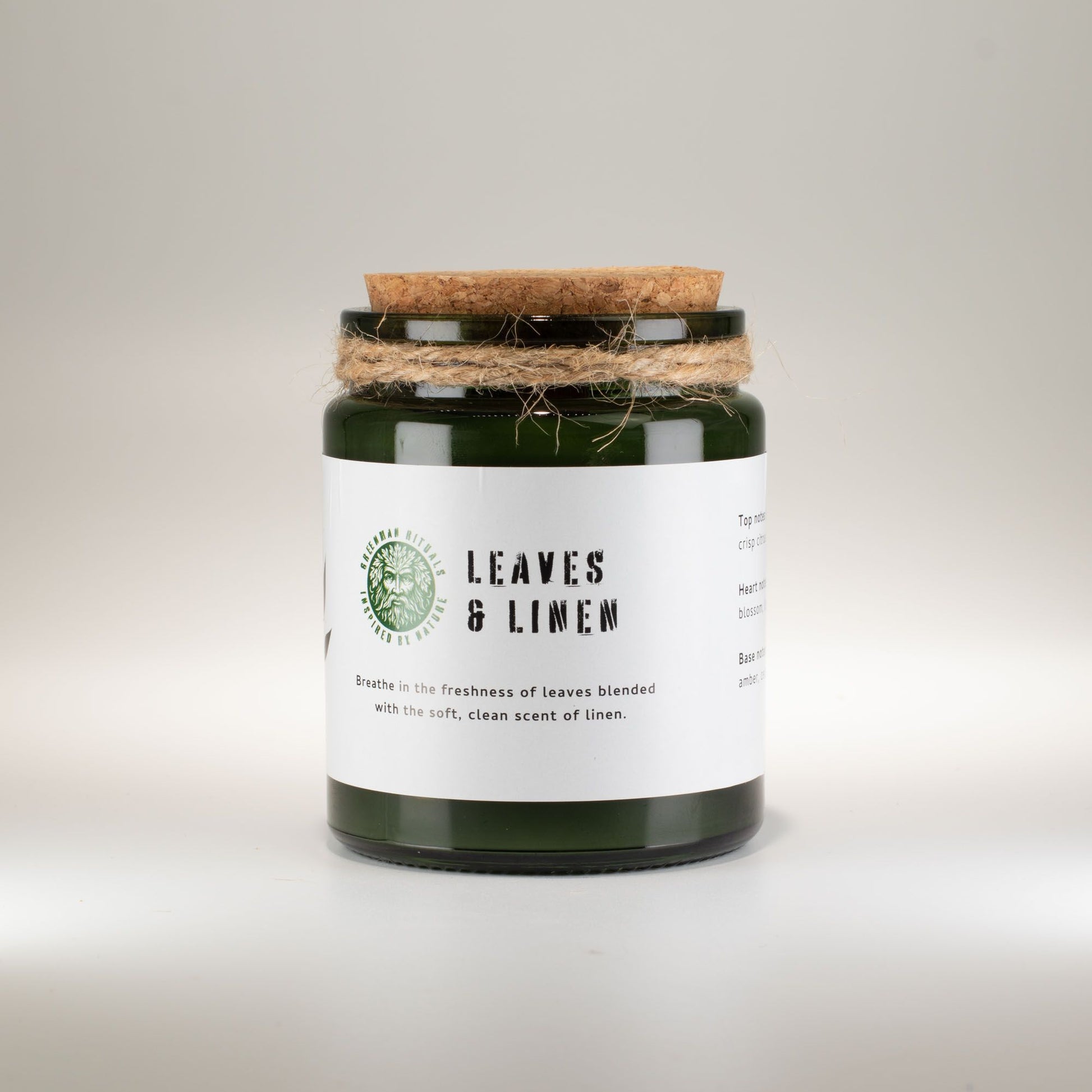 Detailed close up view highlighting the high quality craftsmanship and individual features of the greenman woodwick soy candle leaves linen450