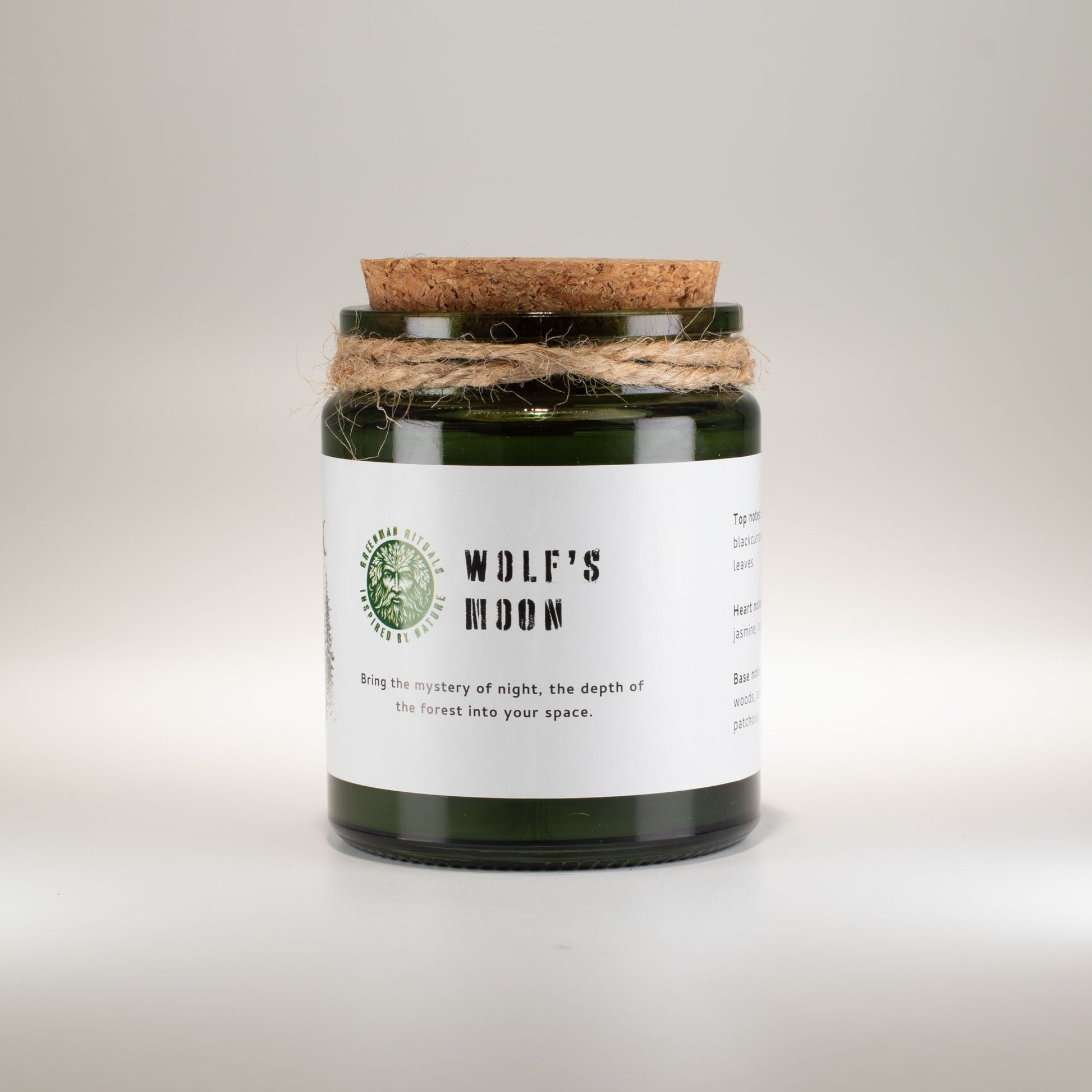 Detailed close up view highlighting the high quality craftsmanship and individual features of the greenman woodwick soy candle wolfs moon556