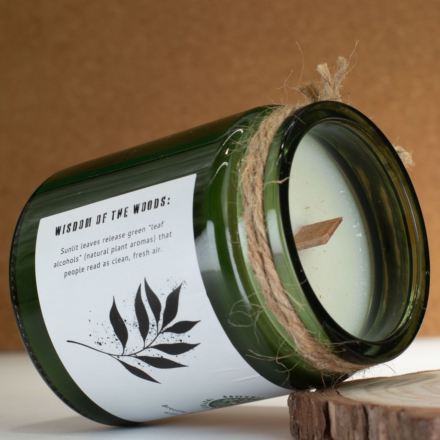 Detailed close up view highlighting the high quality craftsmanship and individual features of the greenman woodwick soy candle leaves linen450