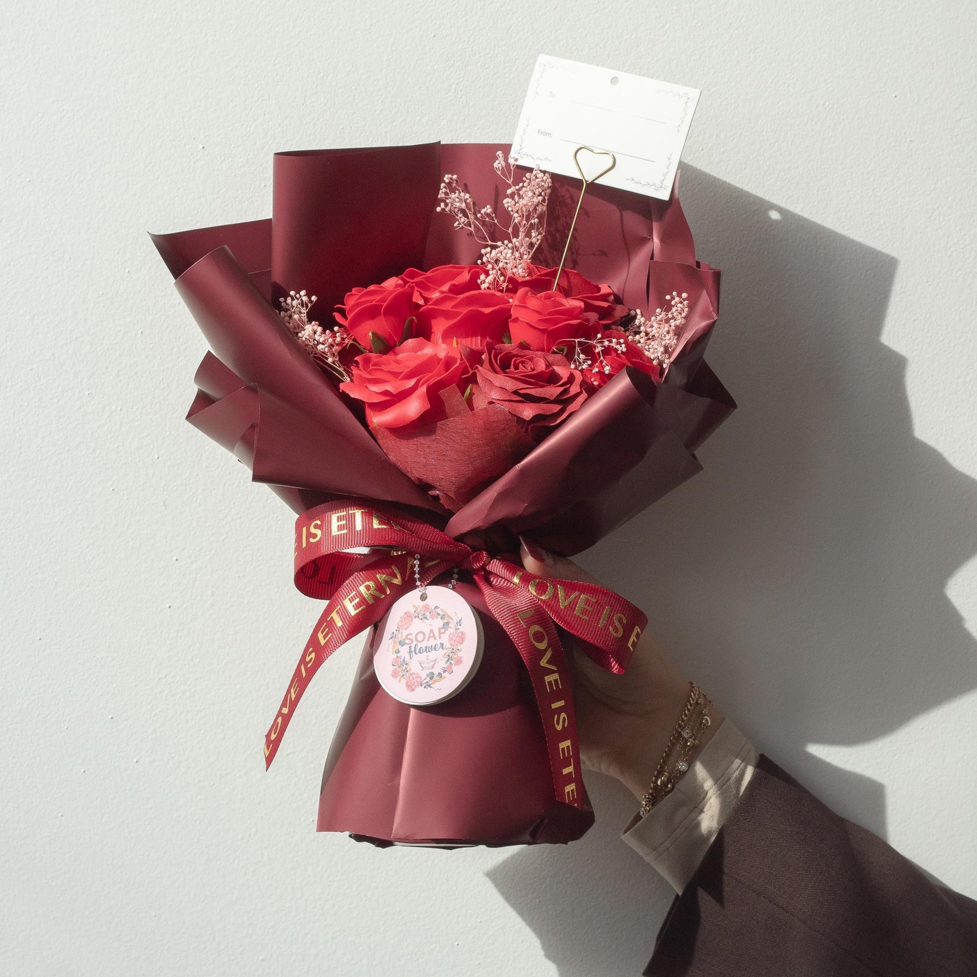 Detailed close up view highlighting the high quality craftsmanship and individual features of the large red roses bouquet love is eternal gift card826
