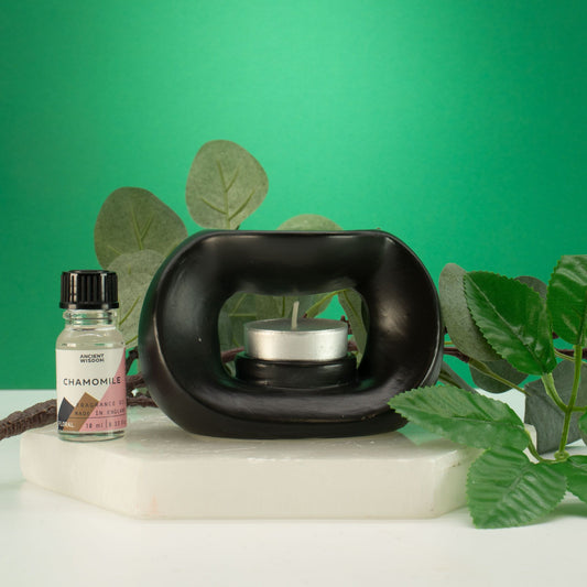 Ceramic Zen Oil Burner - Oval Pebble  - Matt Black lifestyle product photo on neutral background