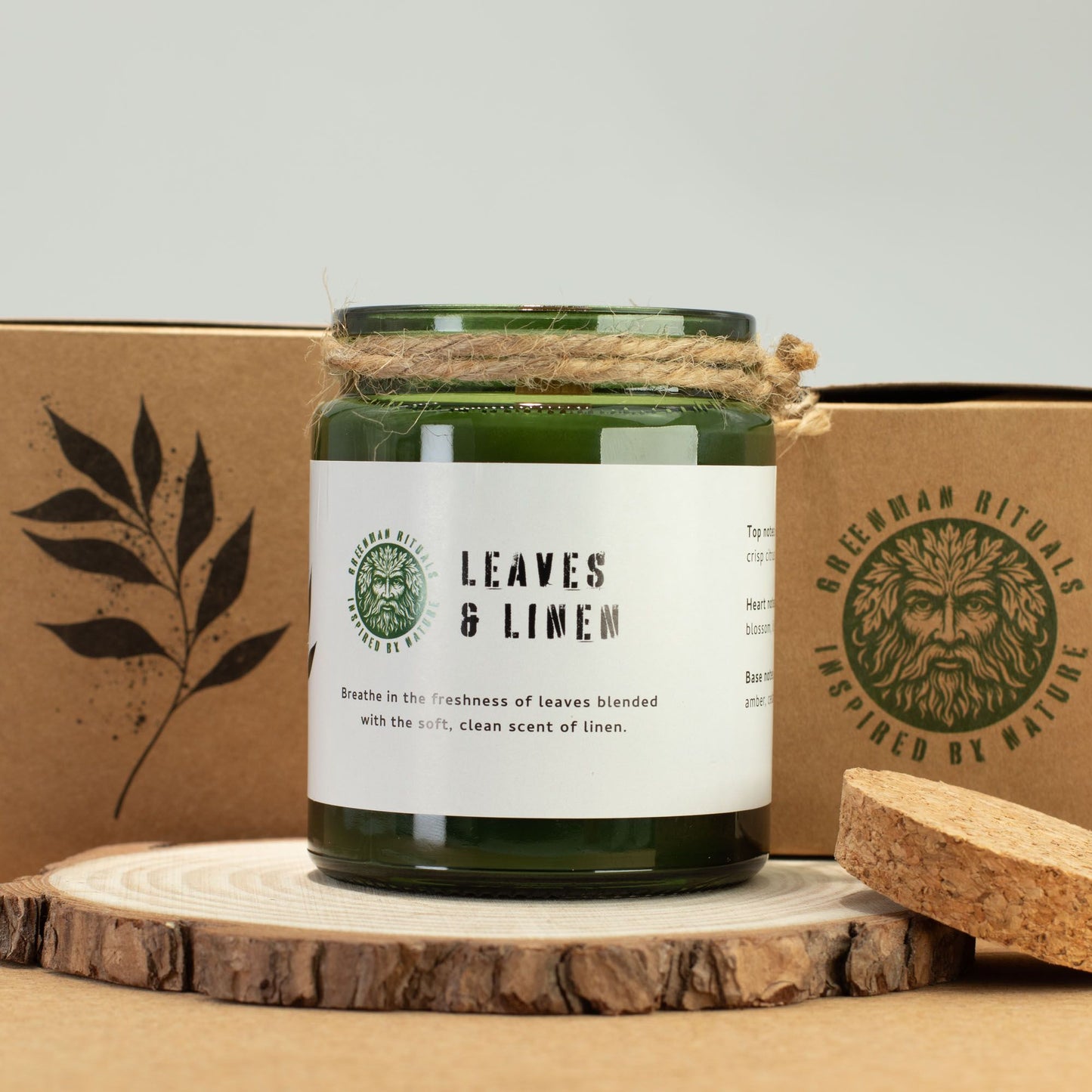 Detailed close up view highlighting the high quality craftsmanship and individual features of the greenman woodwick soy candle leaves linen450