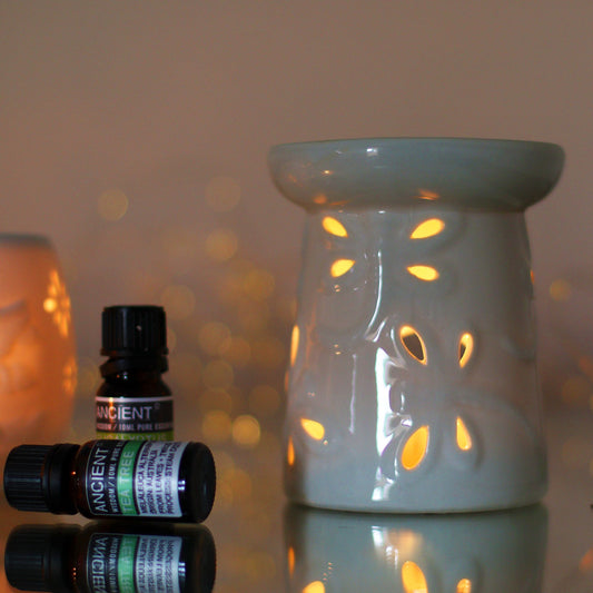 Classic White Oil Burner - Dragonfly lifestyle product photo on neutral background