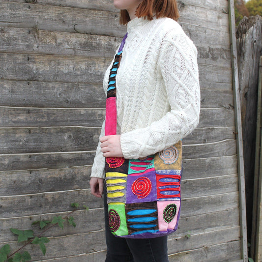 Ethnic Sling Bag - Purple / Spiral lifestyle product photo on neutral background
