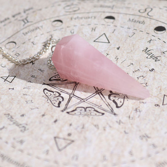 Ancient Witch Spell Incense - Love - Rose Quartz Pendulum lifestyle product photo on neutral background