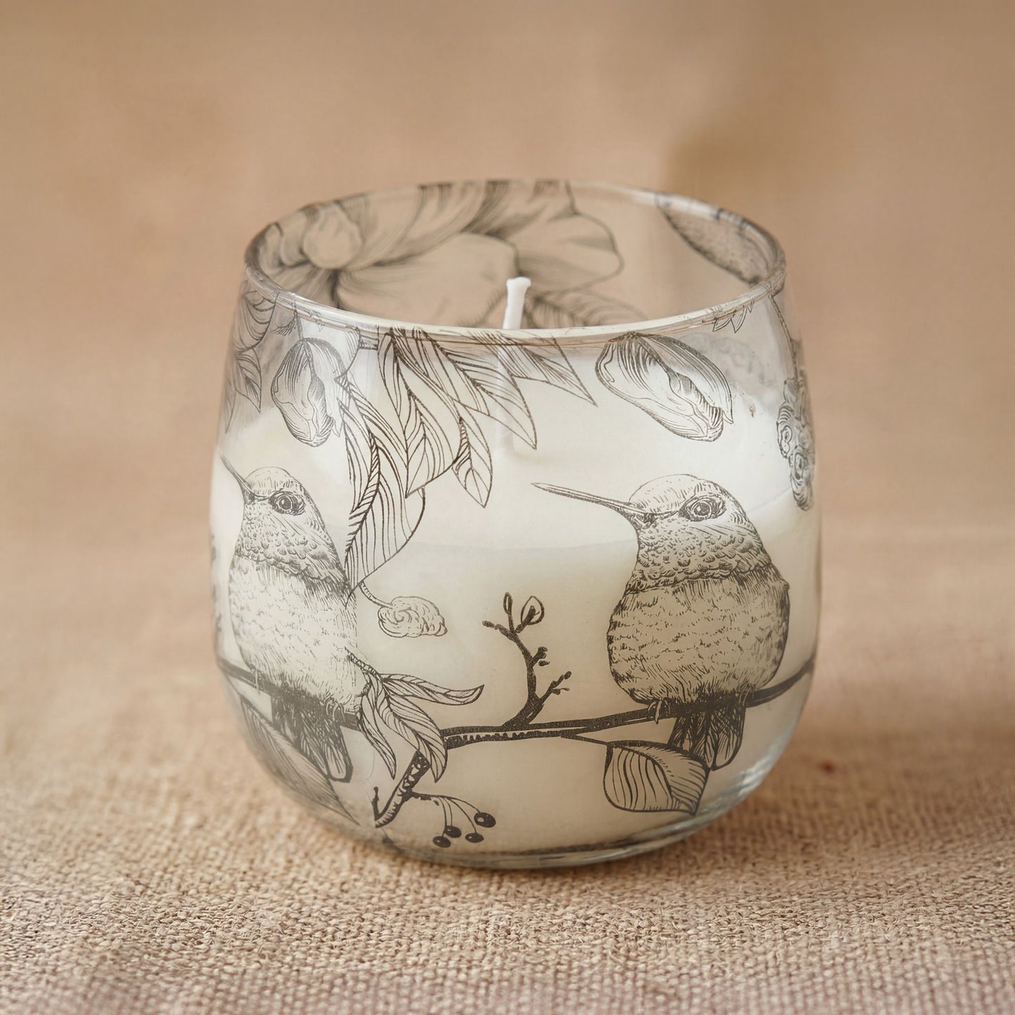 Detailed close up view highlighting the high quality craftsmanship and individual features of the medium glass jar candles drawn by flame385