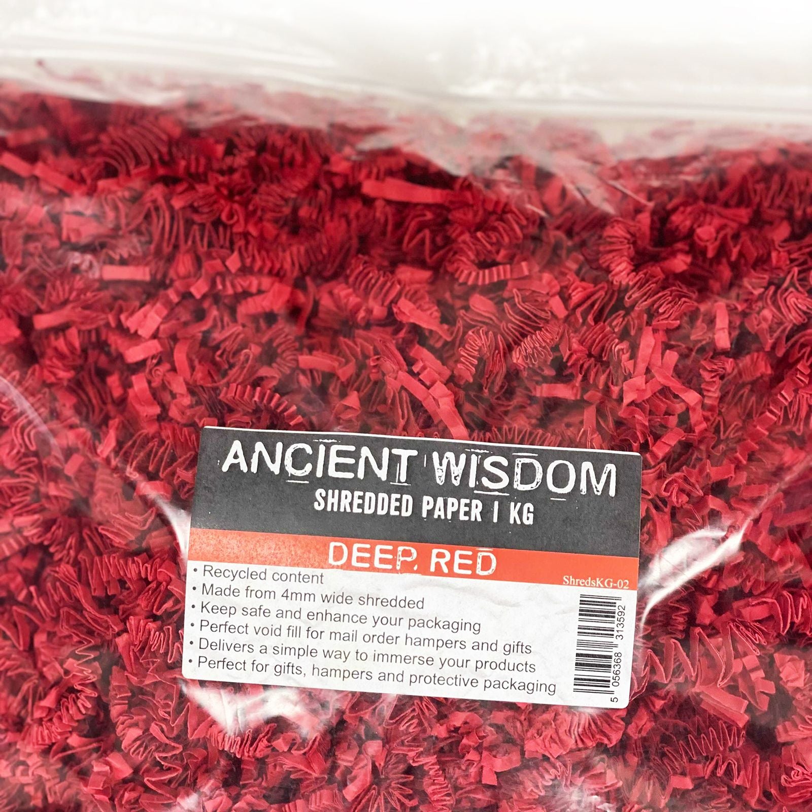 SizzlePak Shredded paper - Deep Red (1KG) lifestyle product photo on neutral background
