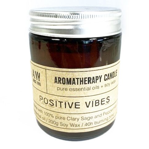 Luxury presentation of the aromatherapy candle positive vibes479 showing the premium artisan packaging and complete set contents