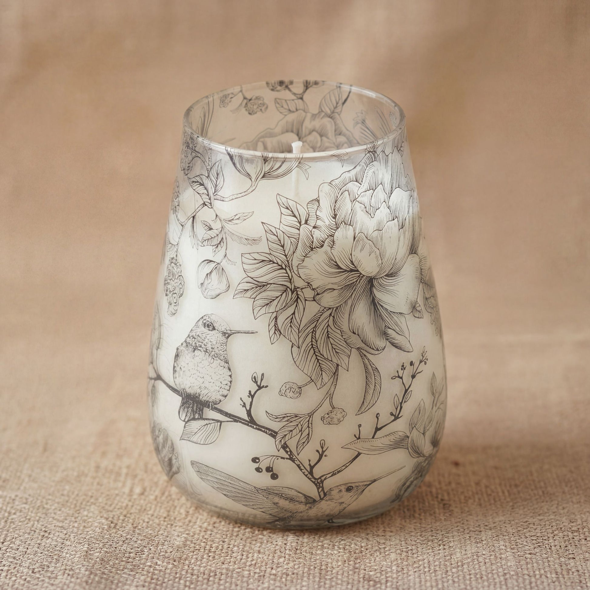Detailed close up view highlighting the high quality craftsmanship and individual features of the tall glass jar candles drawn by flame513