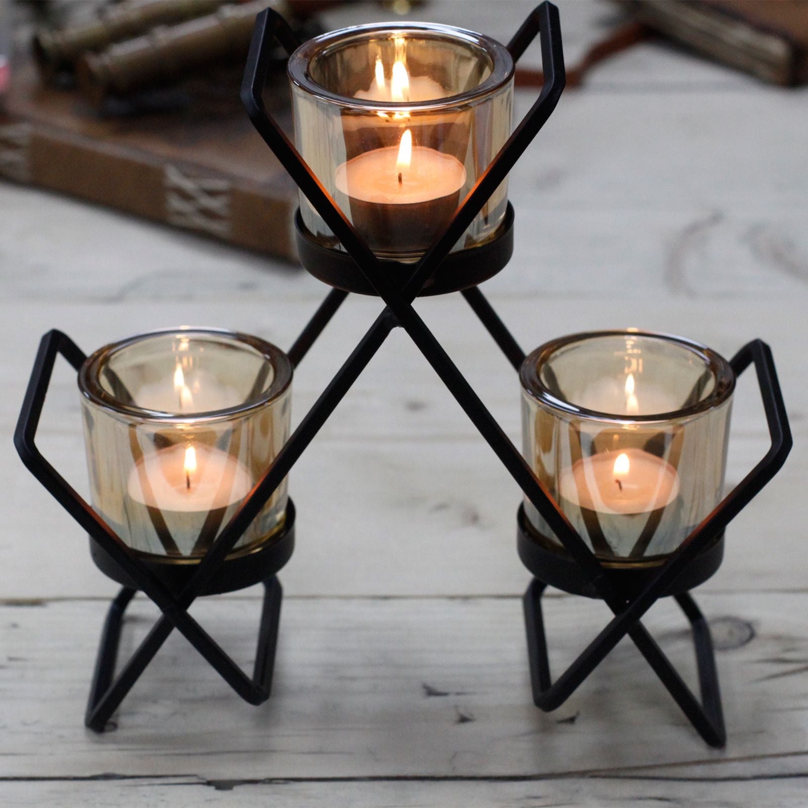 Detailed close up view highlighting the high quality craftsmanship and individual features of the centrepiece iron votive candle holder 3 cup triangle422