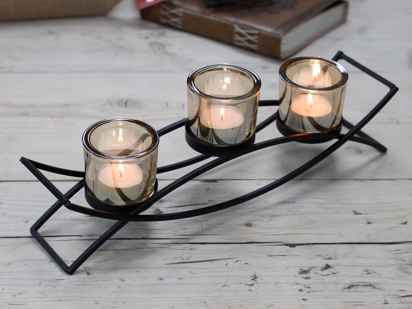 Detailed close up view highlighting the high quality craftsmanship and individual features of the centrepiece iron votive candle holder 3 cup silhouette410