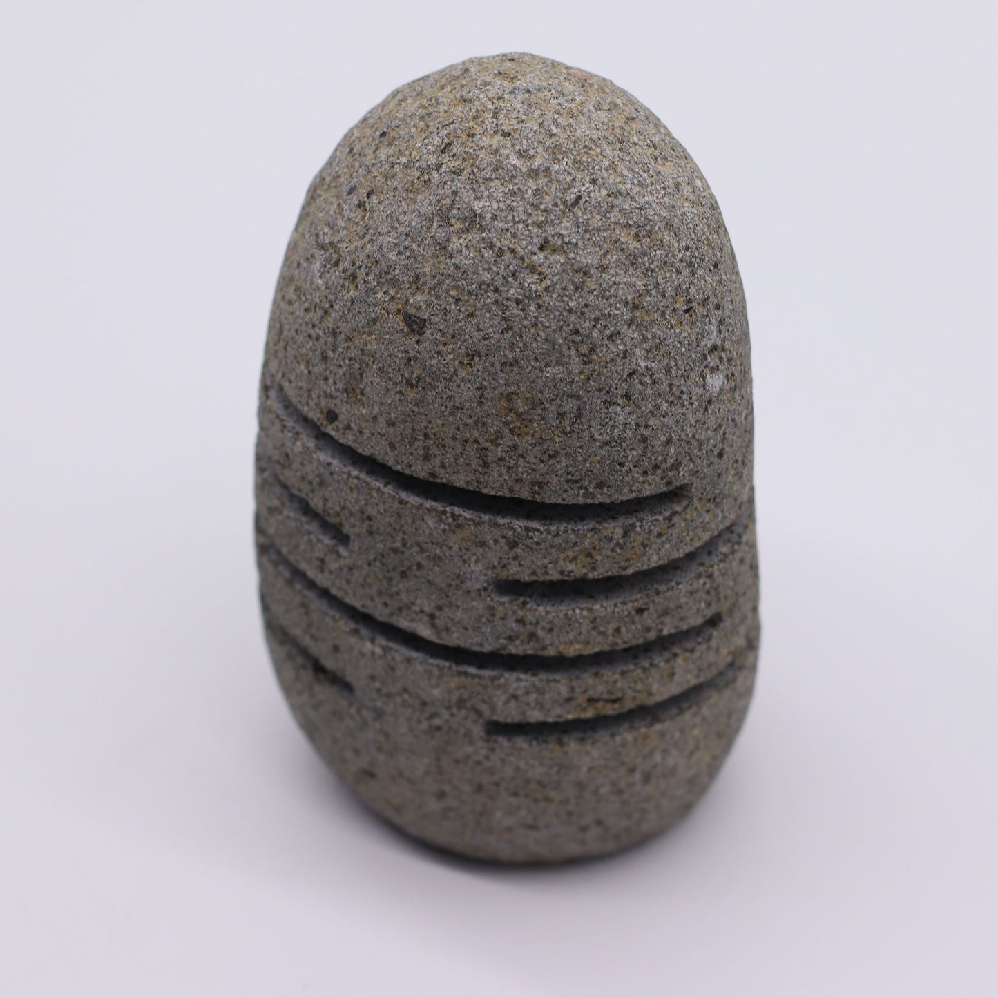 Detailed close up view highlighting the high quality craftsmanship and individual features of the natural riverstone candle holder standing stone cut596