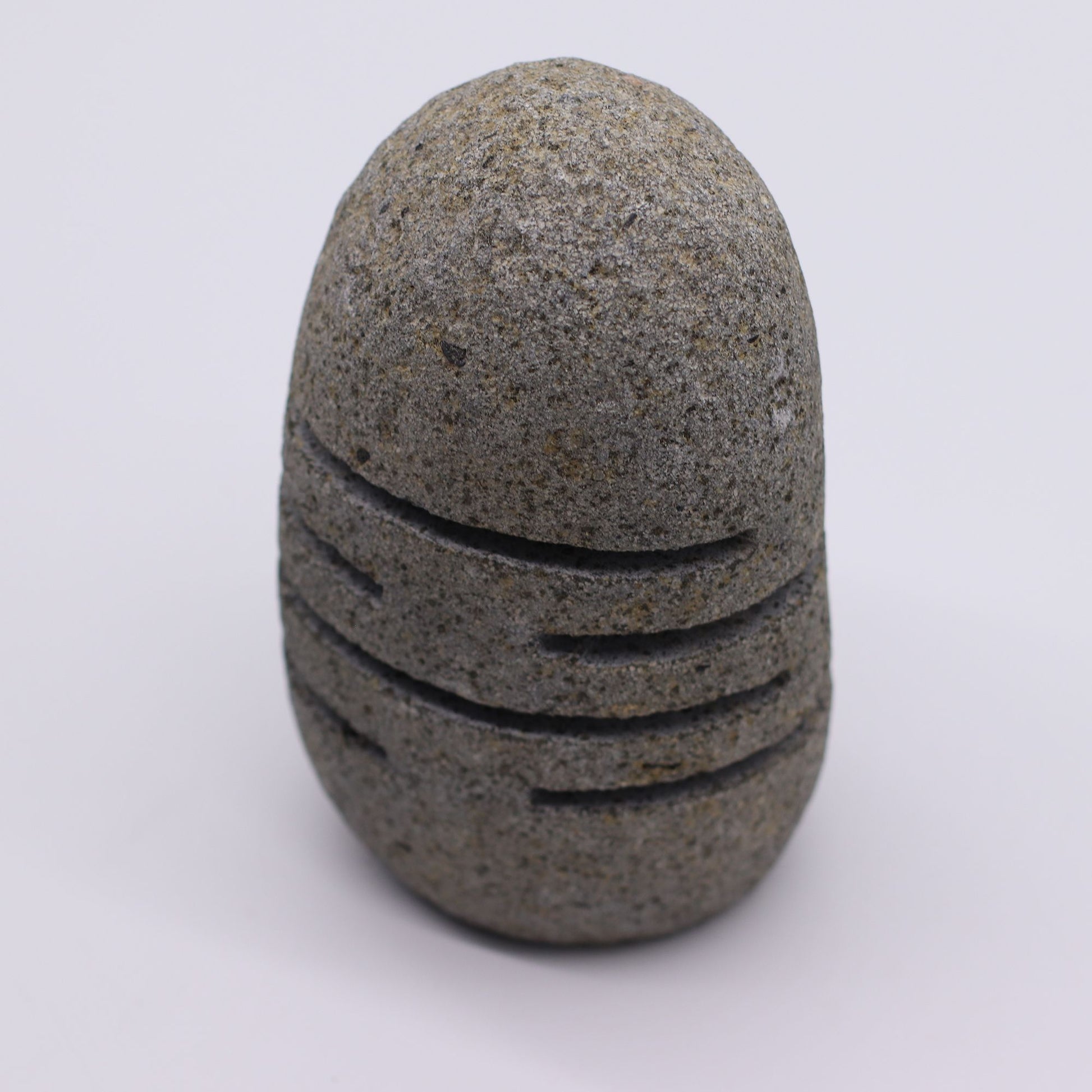 Detailed close up view highlighting the high quality craftsmanship and individual features of the natural riverstone candle holder standing stone cut596