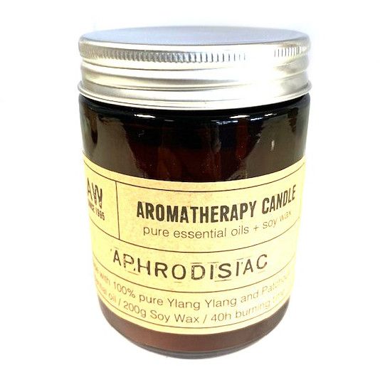 Luxury presentation of the aromatherapy candle aphrodisiac456 showing the premium artisan packaging and complete set contents