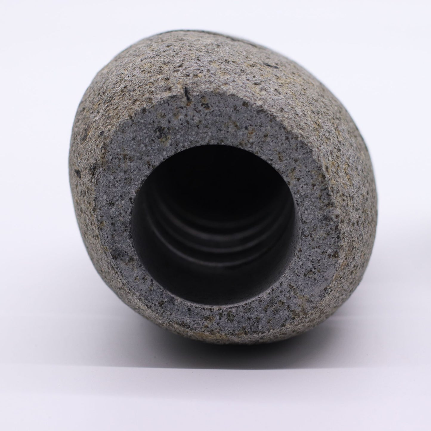 Detailed close up view highlighting the high quality craftsmanship and individual features of the natural riverstone candle holder standing stone cut596