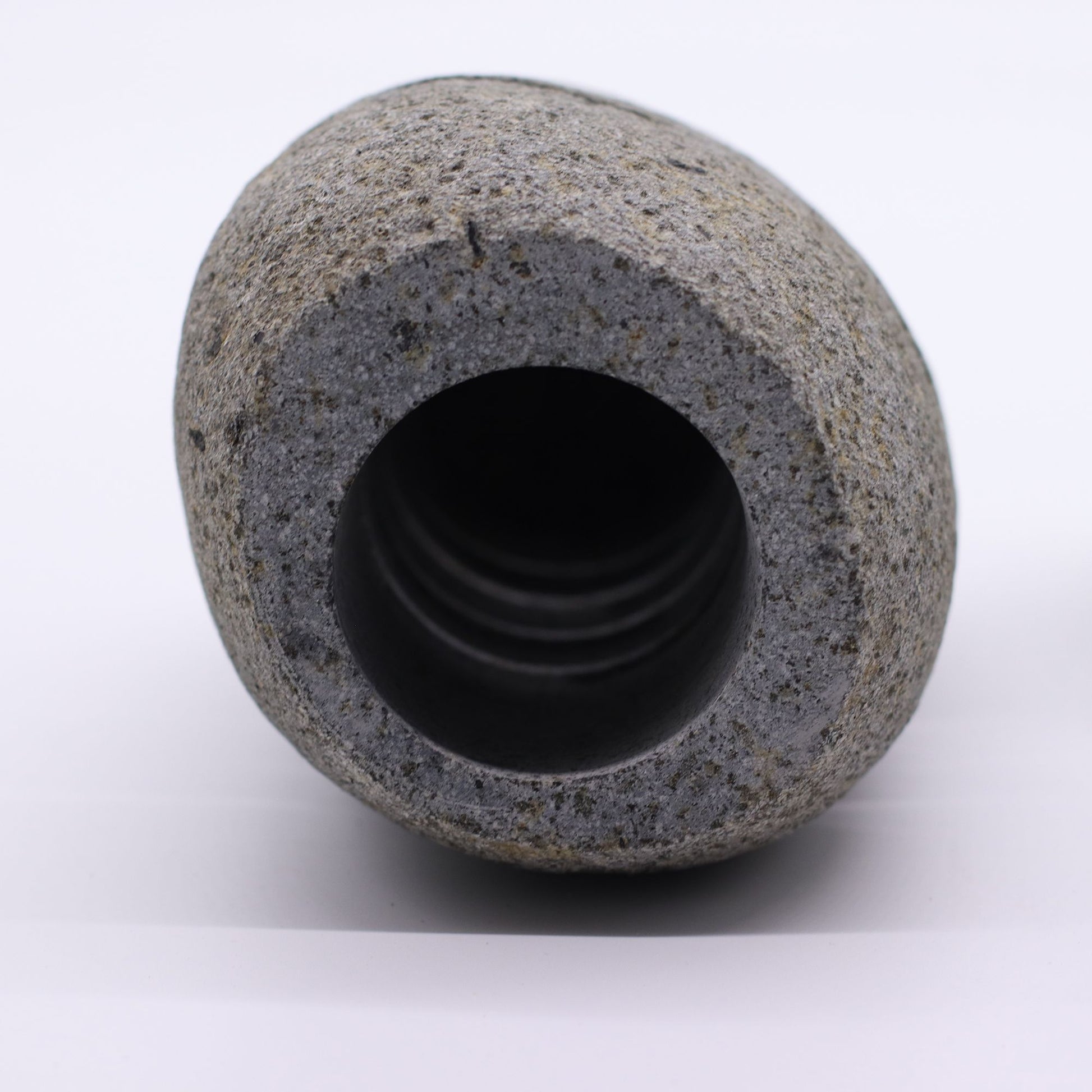 Detailed close up view highlighting the high quality craftsmanship and individual features of the natural riverstone candle holder standing stone cut596