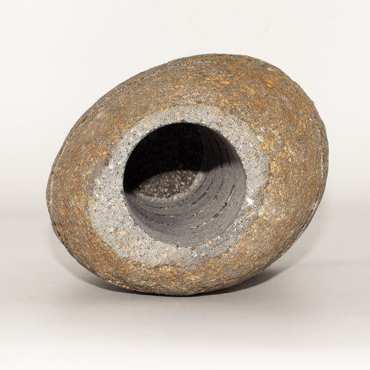 Detailed close up view highlighting the high quality craftsmanship and individual features of the natural riverstone candle holder standing stone cut 10x13x22cm543