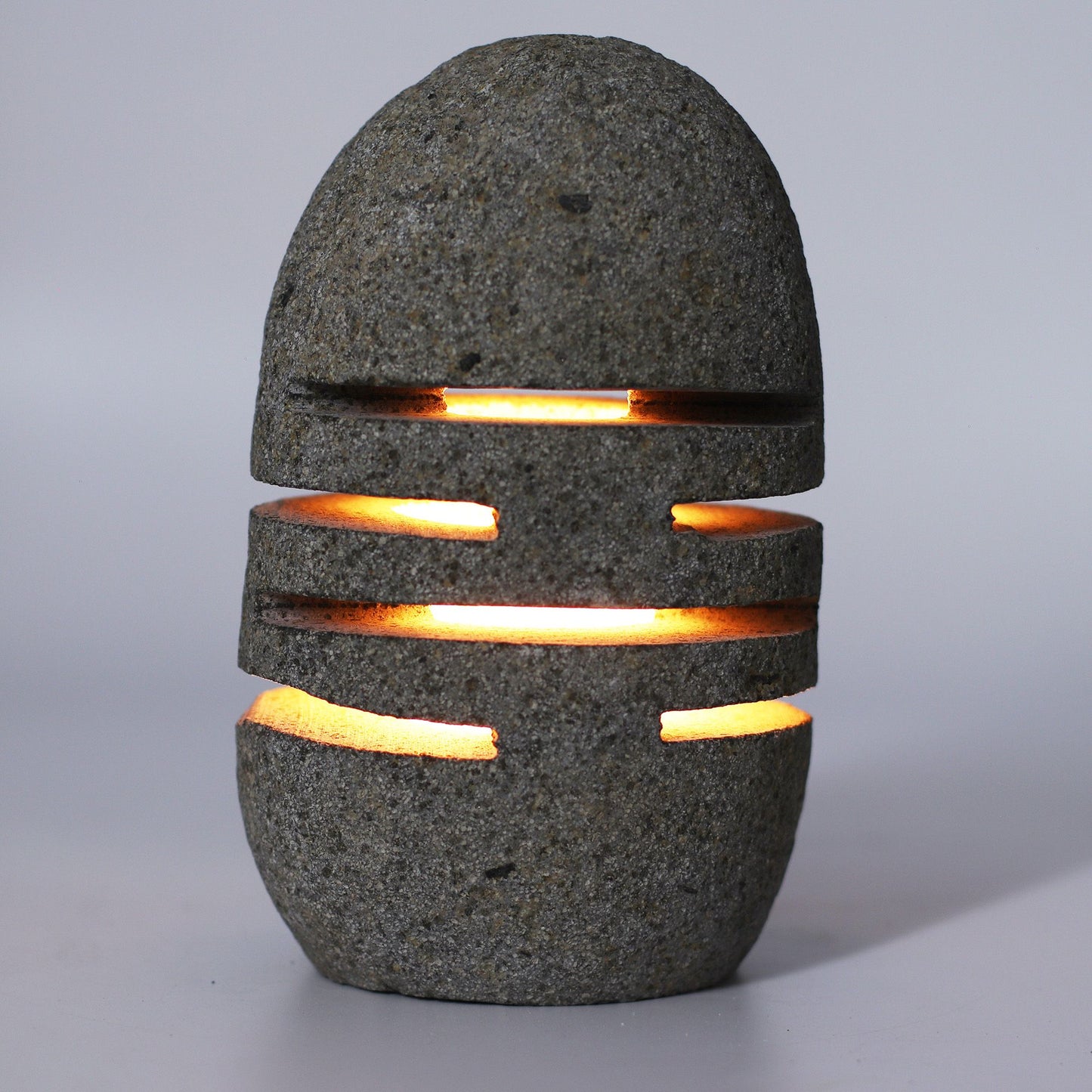 Detailed close up view highlighting the high quality craftsmanship and individual features of the natural riverstone candle holder standing stone cut596