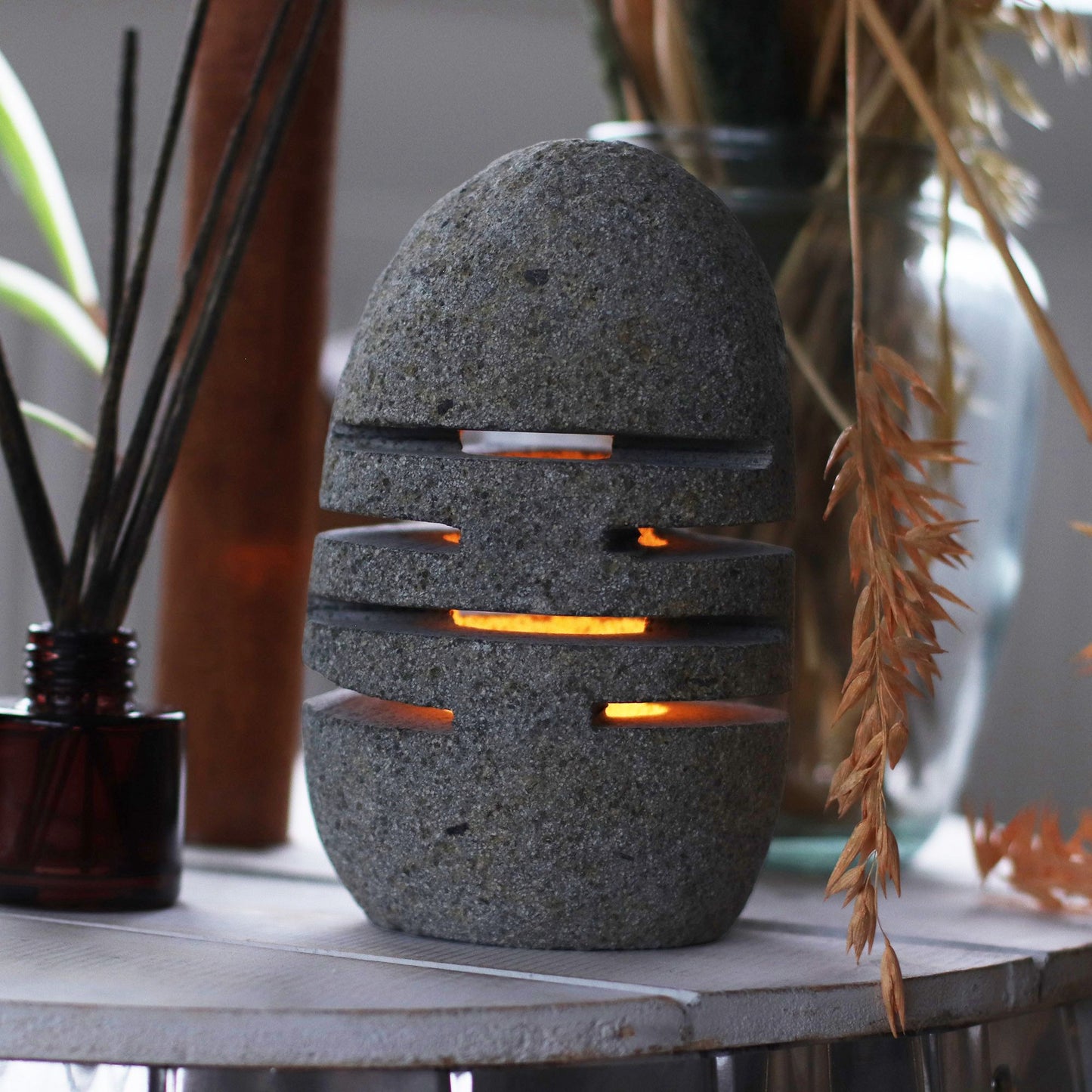 Detailed close up view highlighting the high quality craftsmanship and individual features of the natural riverstone candle holder standing stone cut596