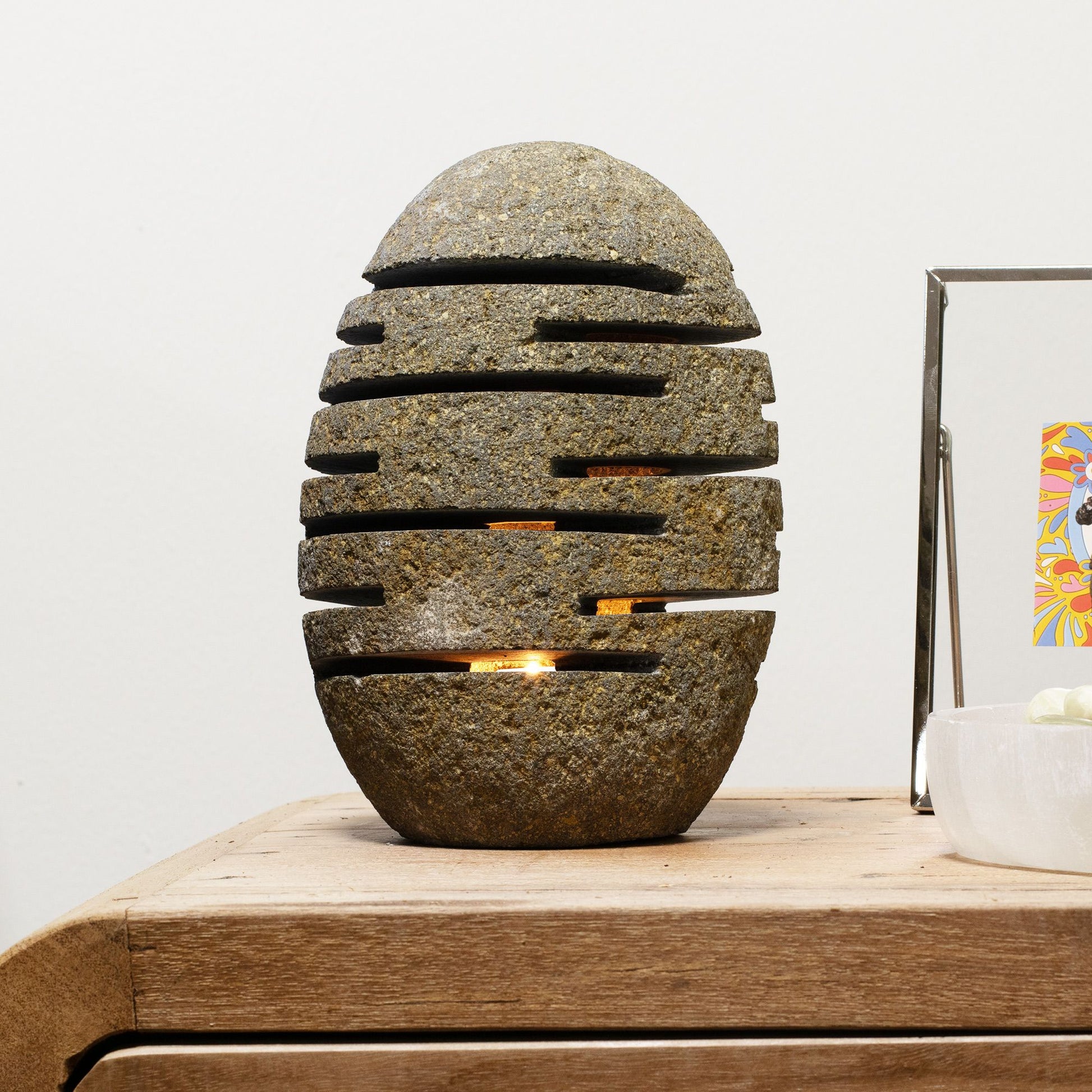 Detailed close up view highlighting the high quality craftsmanship and individual features of the natural riverstone candle holder standing stone cut 10x13x22cm543