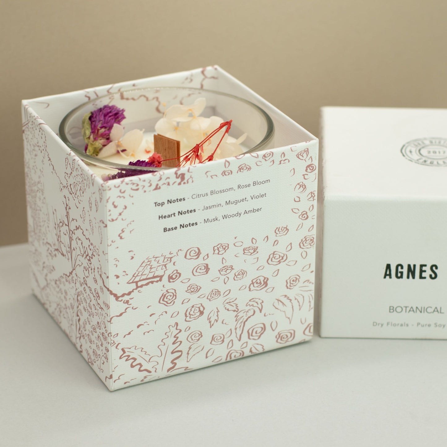 Detailed close up view highlighting the high quality craftsmanship and individual features of the agnes cat botanical soy wax candle roses of sawrey463