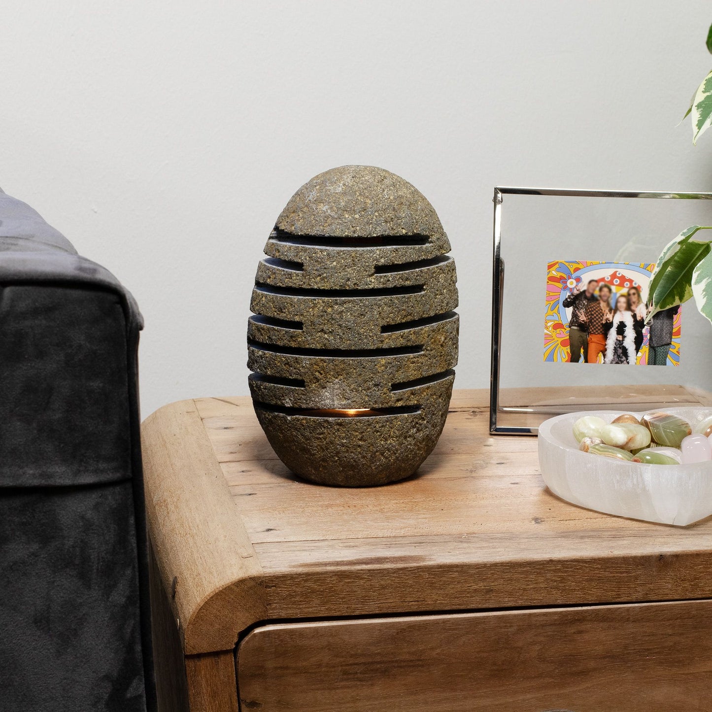 Detailed close up view highlighting the high quality craftsmanship and individual features of the natural riverstone candle holder standing stone cut 10x13x22cm543