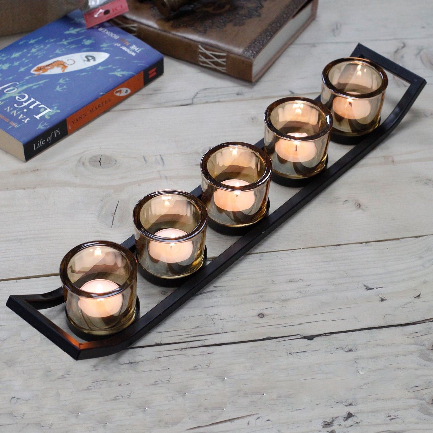 Detailed close up view highlighting the high quality craftsmanship and individual features of the centrepiece iron votive candle holder 5 cup ledge441